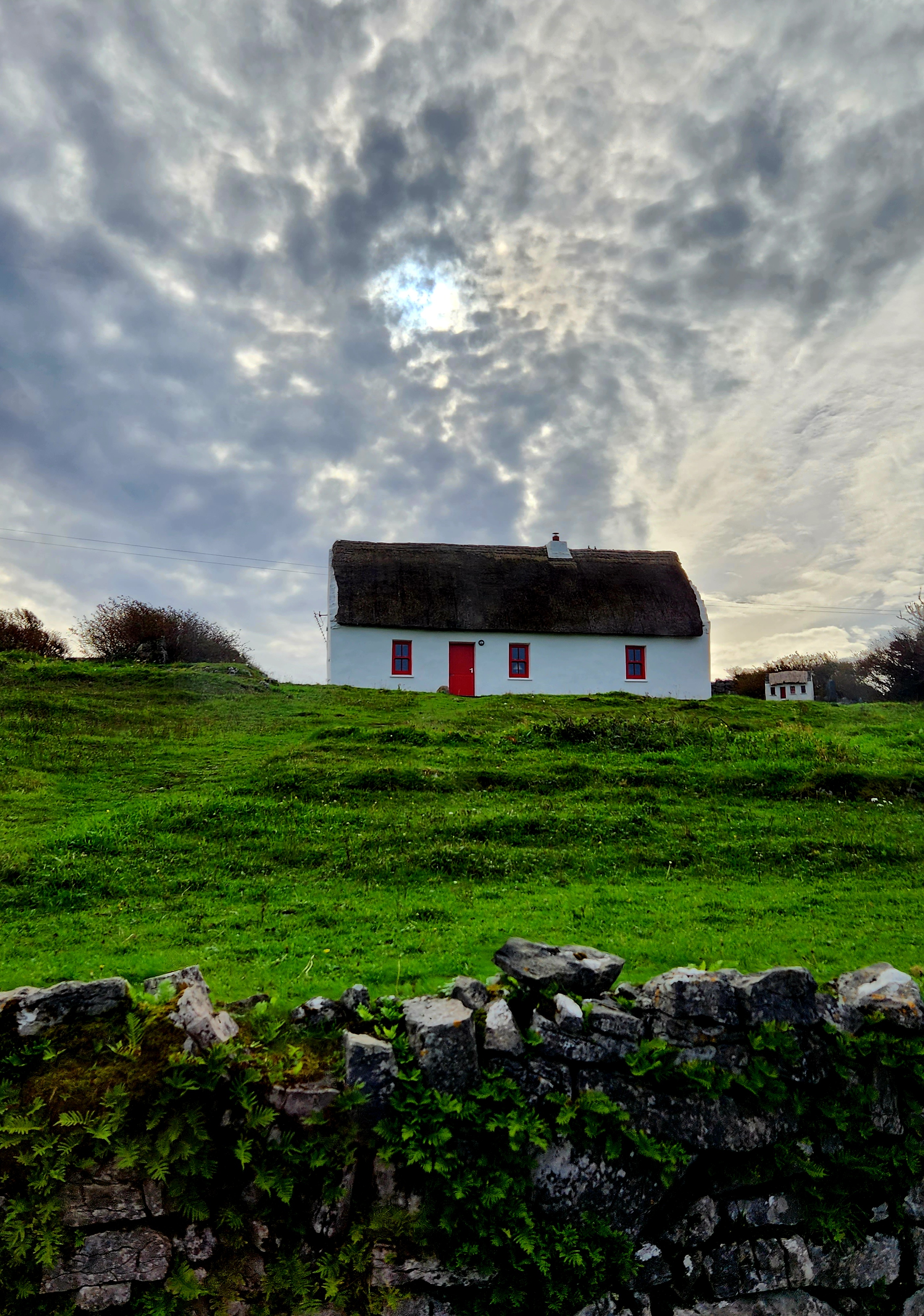 Cottage on grassy hill