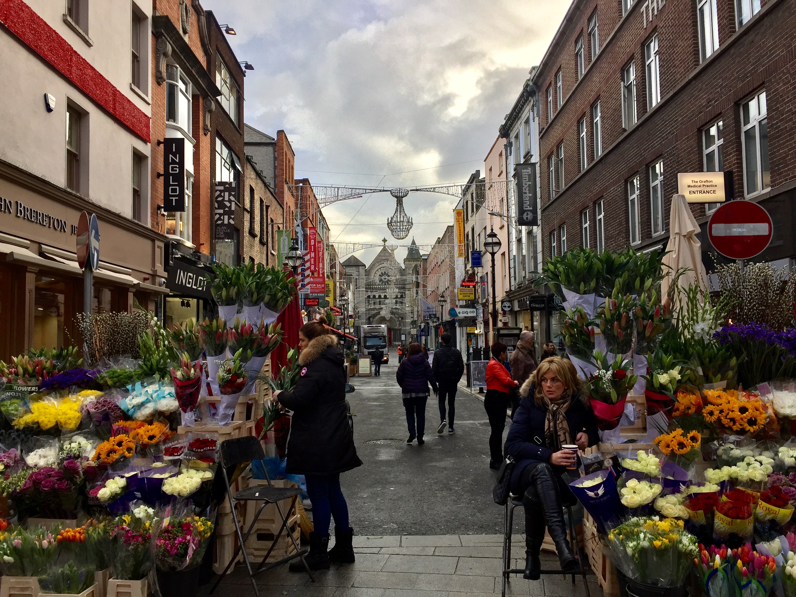 City street with colorful flowers